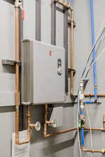 Utility room featuring water heater