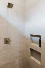 Bathroom view of a tile shower