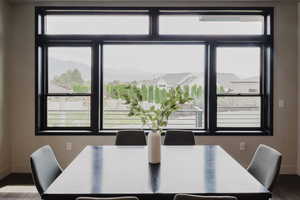 Dining area with wood finished floors and a mountain view