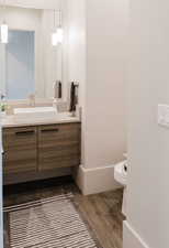 Bathroom with vanity and dark wood finished floors