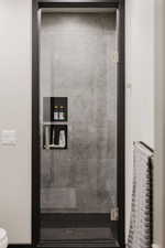 Bathroom featuring toilet and tiled shower