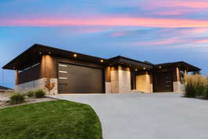 Contemporary house featuring a garage and driveway