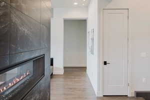 Corridor featuring light wood-style flooring and recessed lighting