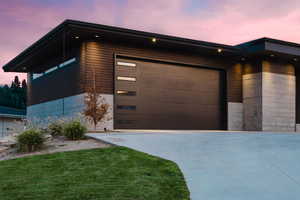 Garage at dusk with driveway