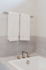 Bathroom featuring a sink and a bath