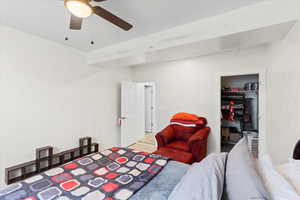 Bedroom with ceiling fan and wood finished floors