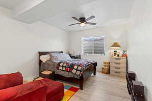 Bedroom featuring light wood-style floors and a ceiling fan