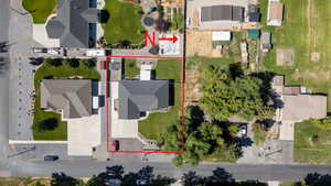 Aerial perspective of suburban area with property parcel outlined