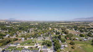 Aerial perspective of suburban area featuring a mountainous background