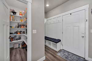 Mudroom with dark wood-style floors