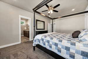 Bedroom featuring dark carpet, ensuite bathroom, a ceiling fan, and recessed lighting