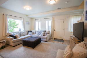 Living area with light wood-type flooring and baseboards