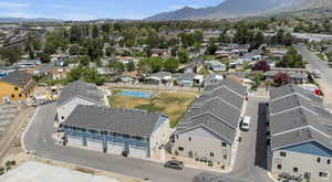 Aerial view of residential area featuring a mountain backdrop