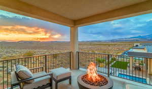 Balcony with a mountain view and an outdoor fire pit