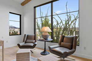 Sitting room featuring light wood-style floors and baseboards