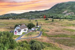 Aerial view at dusk of a mountain view and a view of countryside