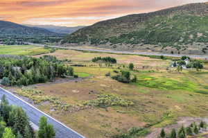 View of mountain backdrop with rural landscape