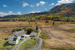 Aerial view of sparsely populated area with a mountainous background