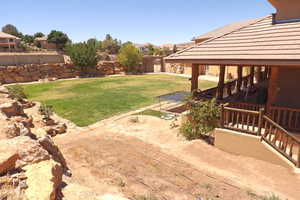 Fenced backyard with a patio