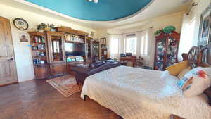 Bedroom featuring a raised ceiling
