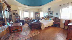 Bedroom featuring a tray ceiling