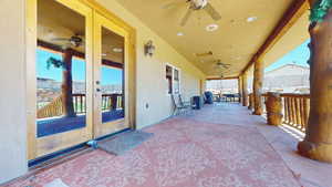 View of patio with a ceiling fan