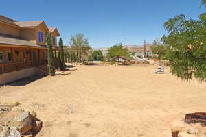 View of yard featuring covered porch