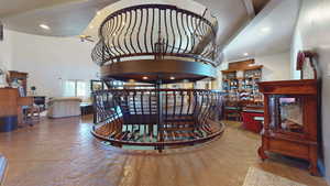 Interior space with a high ceiling, ceiling fan, and recessed lighting