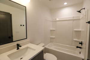 Full bath featuring  shower combination and vanity