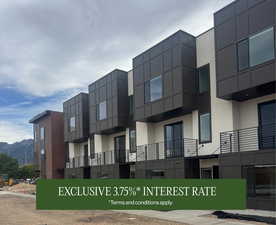 View of building exterior featuring a mountain view
