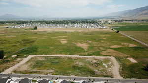 Aerial view of property's location with nearby suburban area and rural landscape