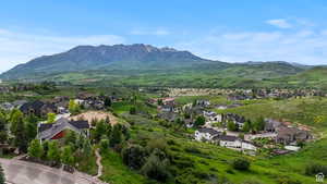 Aerial perspective of suburban area with a mountain backdrop