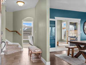 Entryway featuring stairs and wood finished floors