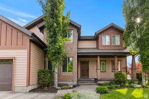 Craftsman-style house featuring board and batten siding and a porch