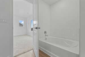 Bathtub with subway tile surround and chrome fixtures