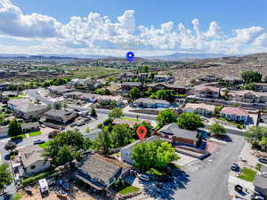 Aerial perspective of suburban area with a mountain backdrop