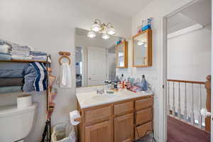 Bathroom with vanity and a chandelier
