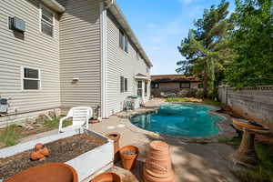 View of pool with a fenced backyard and a patio