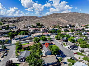 Aerial view of residential area featuring a mountain backdrop