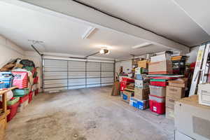 Garage featuring a garage door opener