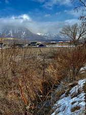 View of mountain backdrop featuring rural landscape