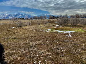 View of mountain background featuring rural landscape