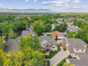 Aerial perspective of suburban area with a mountainous background