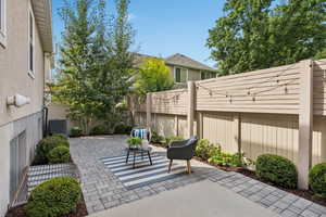 Fenced backyard featuring a patio