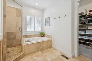 Main Level Primary Bedroom Ensuite and walk-in closet