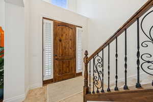 Foyer featuring tile patterned flooring and baseboards