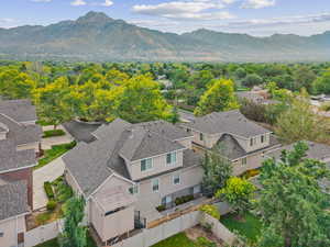 Aerial perspective of suburban area with a mountain backdrop
