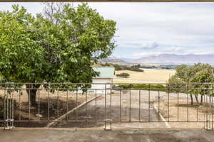 Gate with a mountain view and a balcony