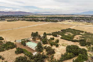 Aerial view of sparsely populated area with a mountainous background