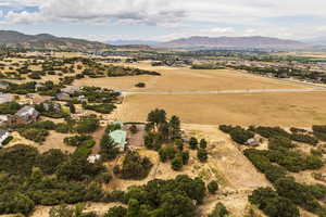 Overview of rural landscape with a mountain backdrop